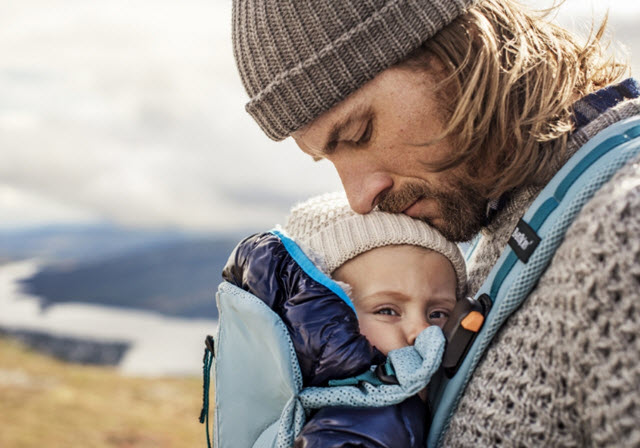 Dad carrying infant in the BabyBjorn One Outdoors